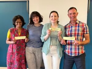 Nimmi. Charlie, Bryony and Patrick receiving award ribbons